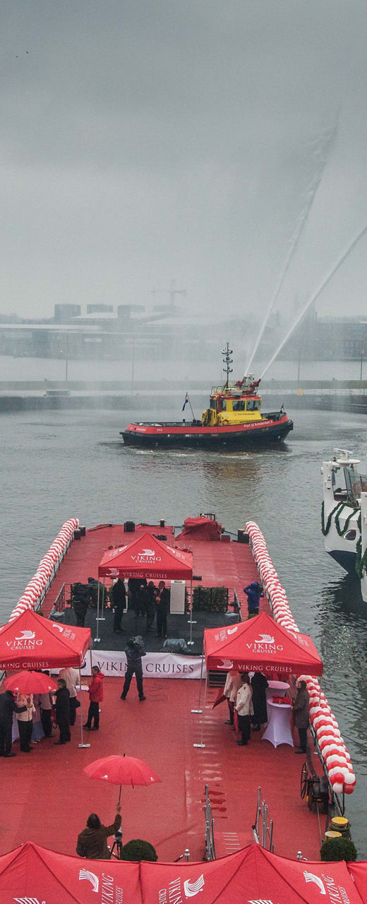 Harbor Celebration with Decorated Boats and Tugboat Display