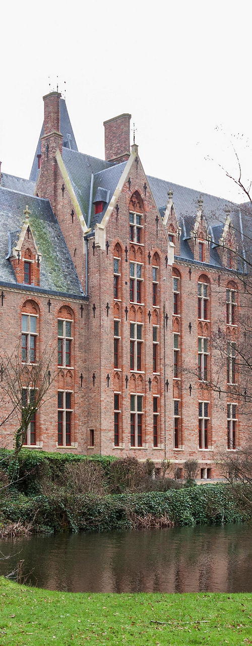 Historic brick castle with surrounding moat