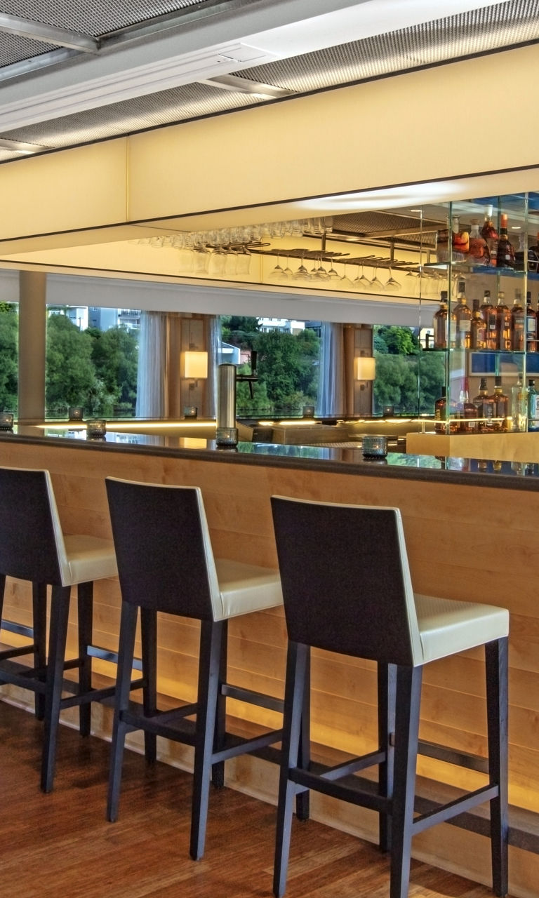 Modern bar lounge with scenic river view