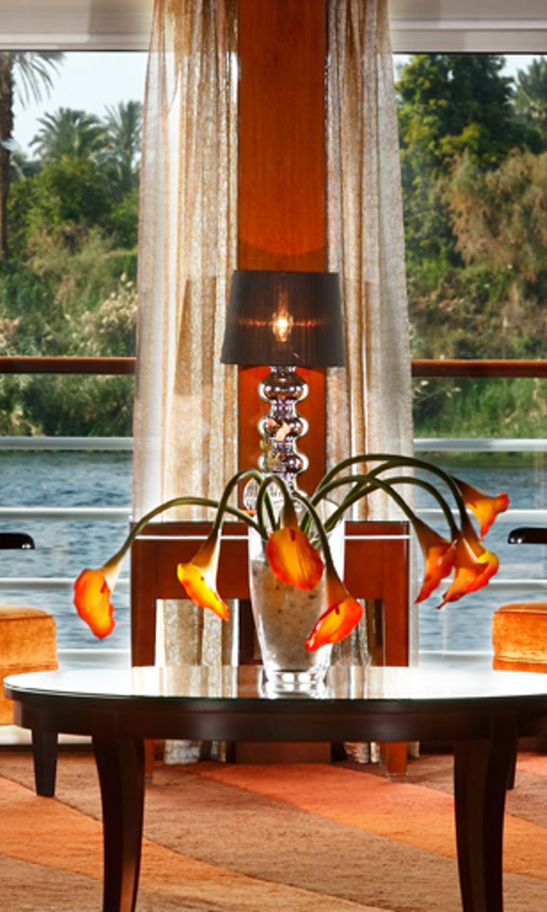 Elegant lounge with river view and warm decor