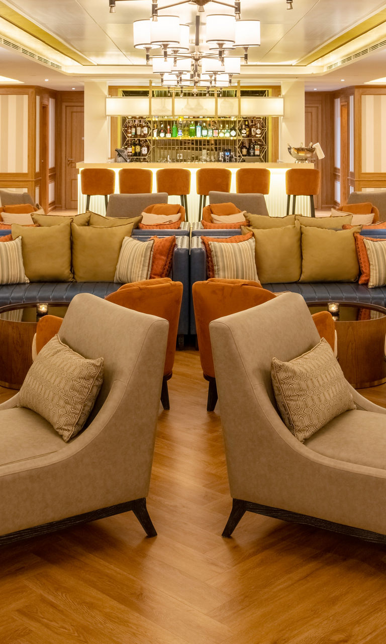 Elegant lounge with warm lighting and seating