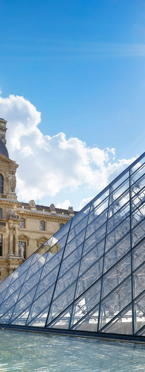 Louvre Museum and glass pyramid in sunlight