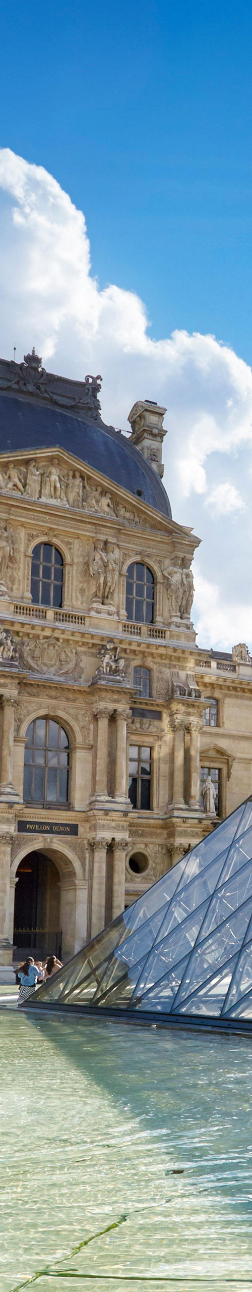 Louvre Museum and glass pyramid in sunlight