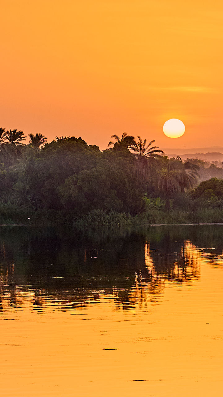 Serene sunset over tranquil river landscape