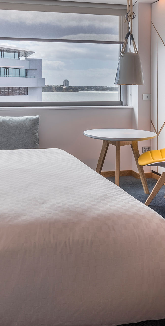Modern hotel room with yoga-themed decor