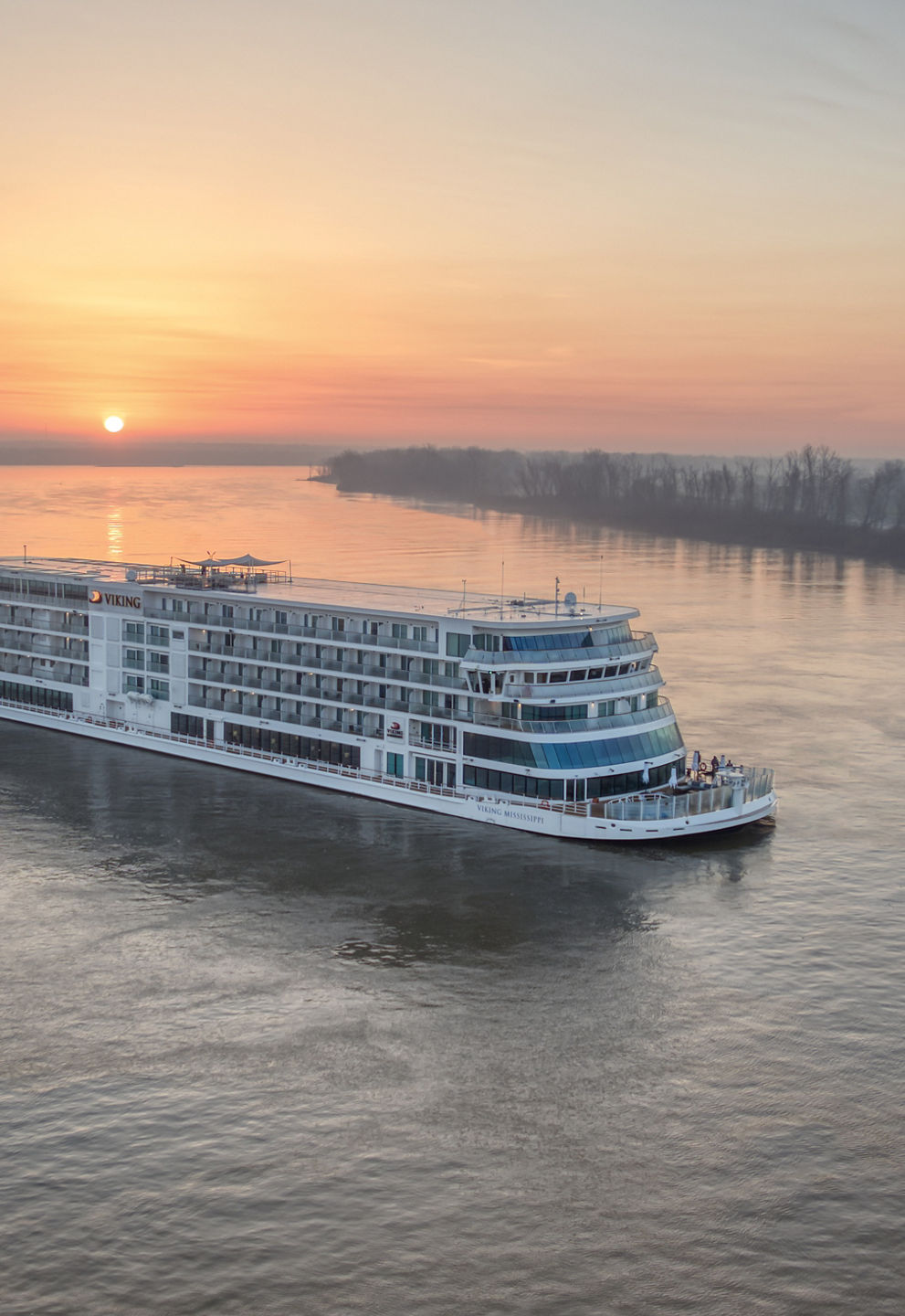 Luxury river cruise ship at sunrise