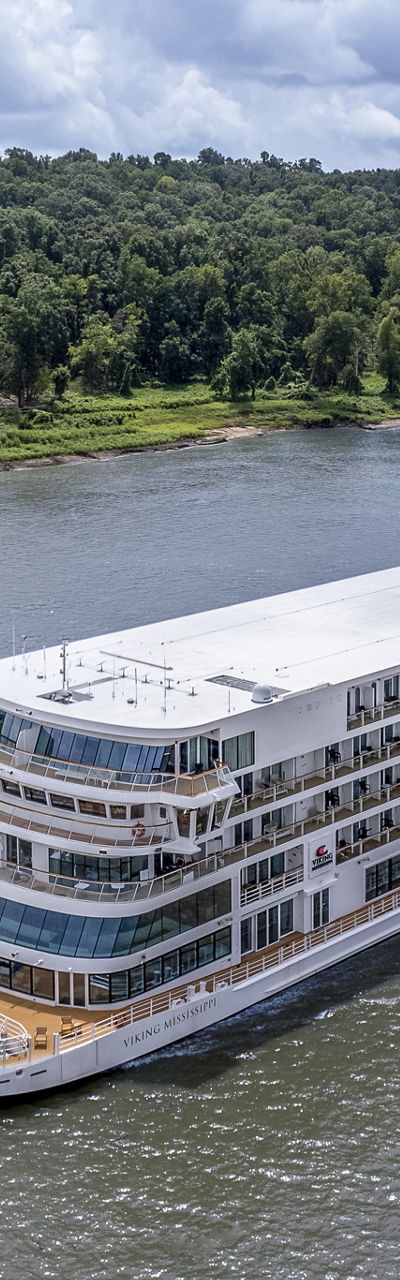 Luxury river cruise ship on scenic waterway
