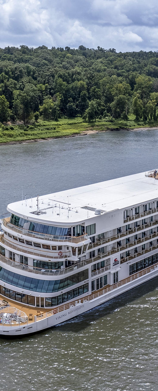 Luxury river cruise ship on scenic waterway