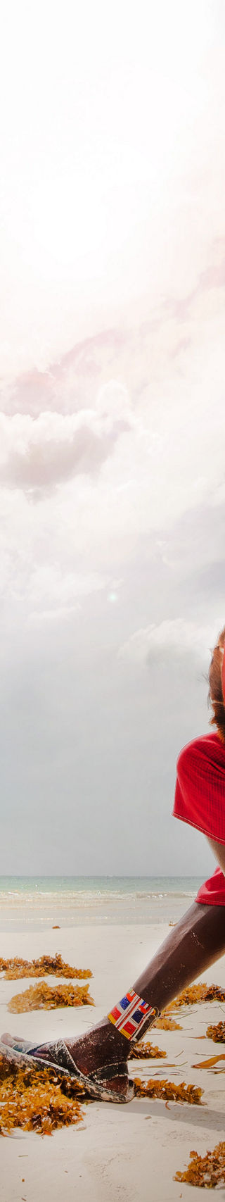 Maasai Warrior by the Ocean Shore