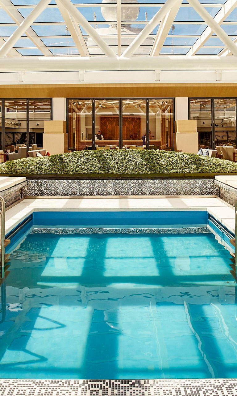 Luxury indoor pool with glass ceiling