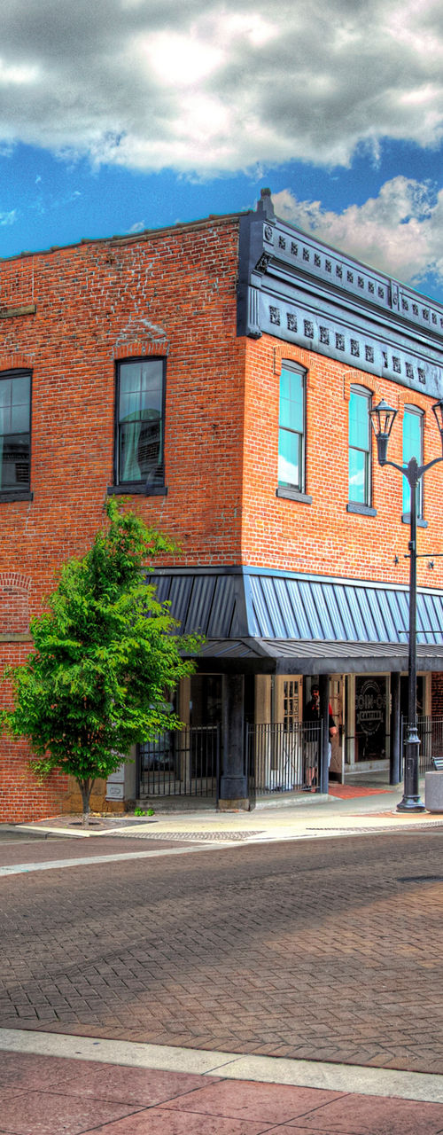 Historic downtown street with clock and brick buildings