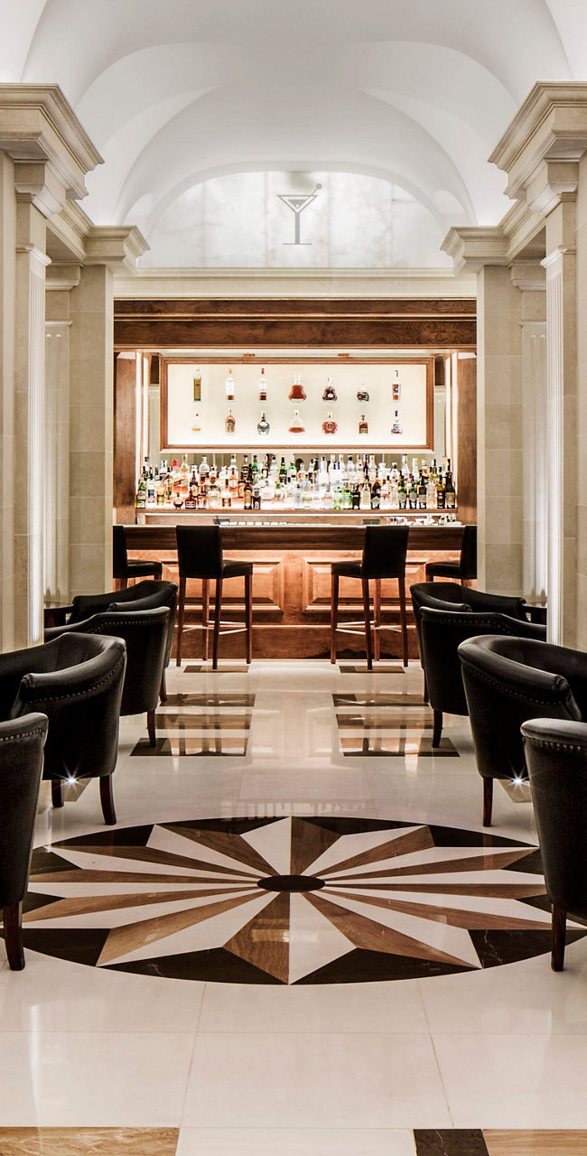 Elegant hotel lounge with bar and seating