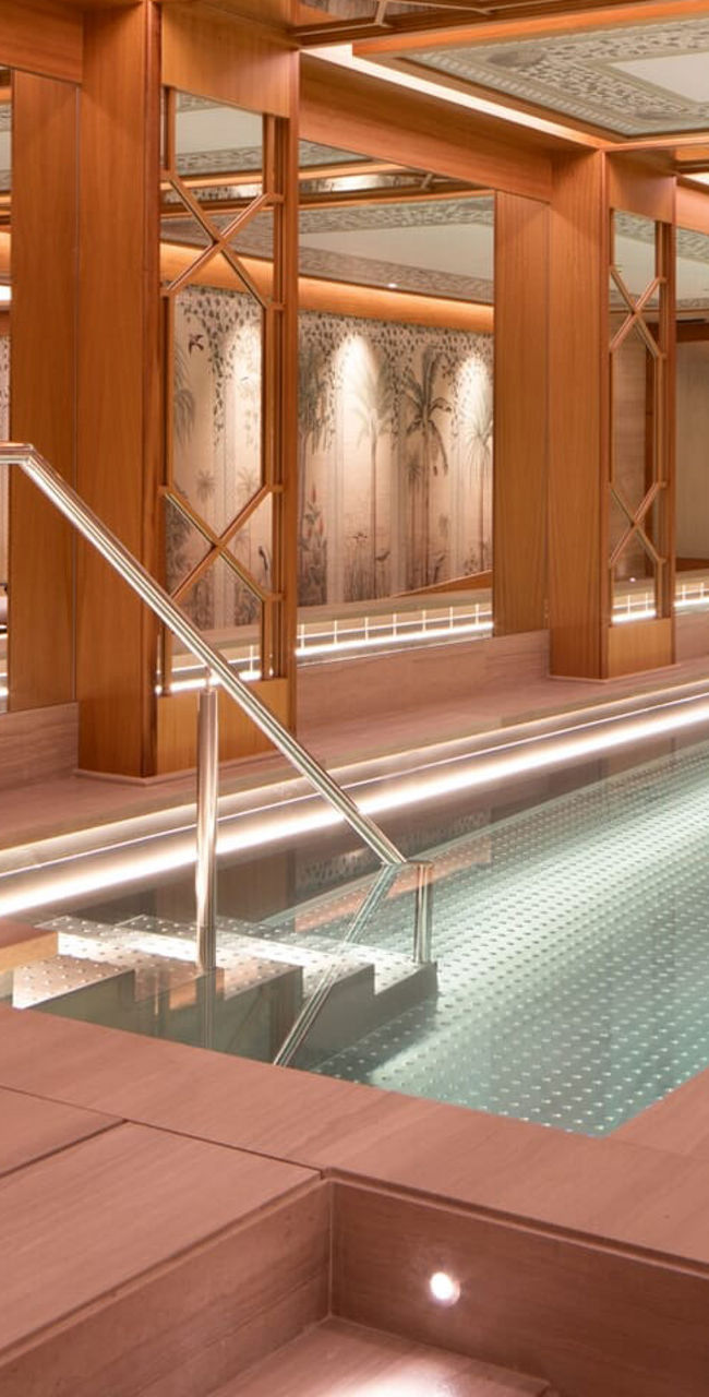 Luxurious indoor spa pool with warm lighting