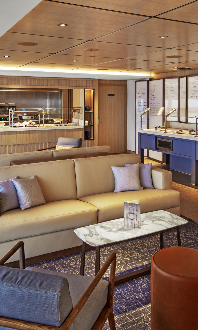 Modern lounge with buffet and seating area