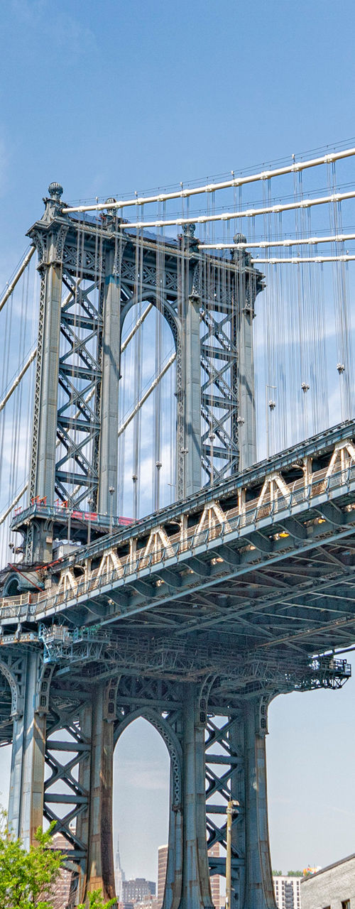 Manhattan Bridge framed by brick buildings