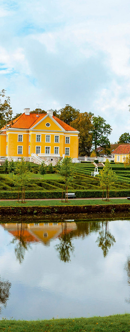 Scenic lakeside estate with autumn trees