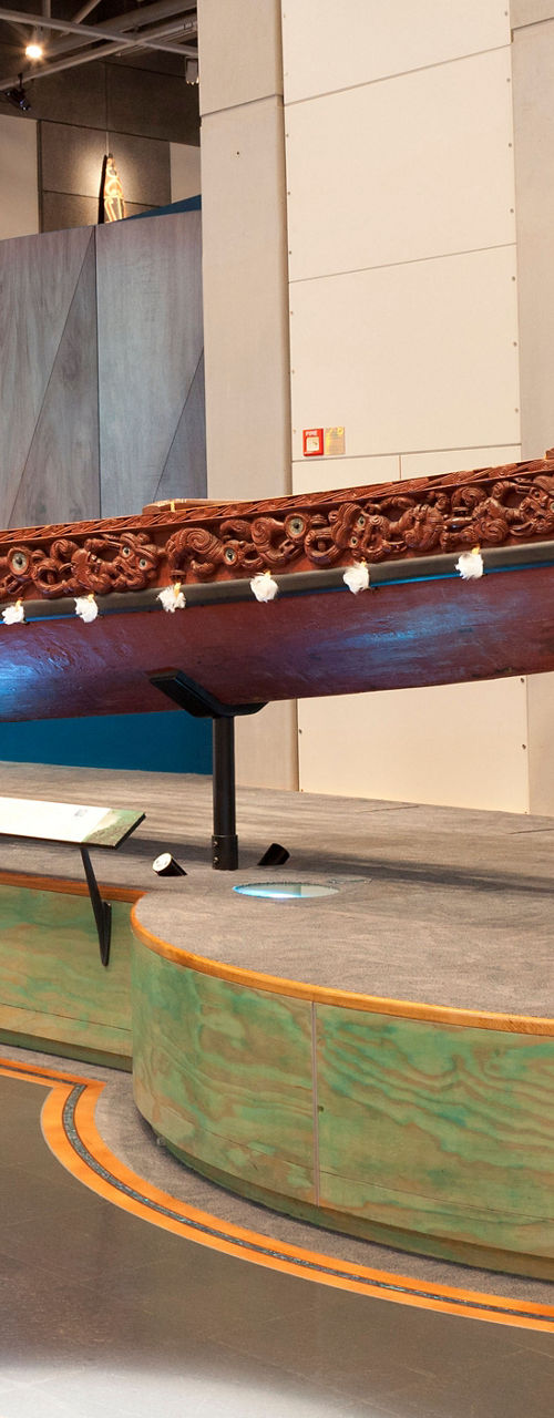 Traditional wooden canoe in museum exhibit