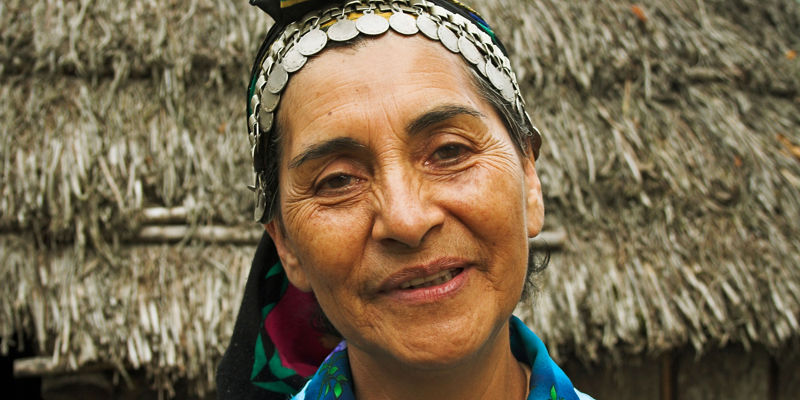 Traditional attire with rustic thatched hut