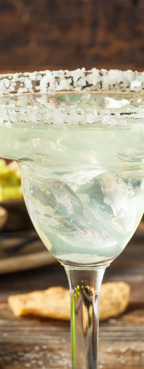 Refreshing margaritas with lime garnish