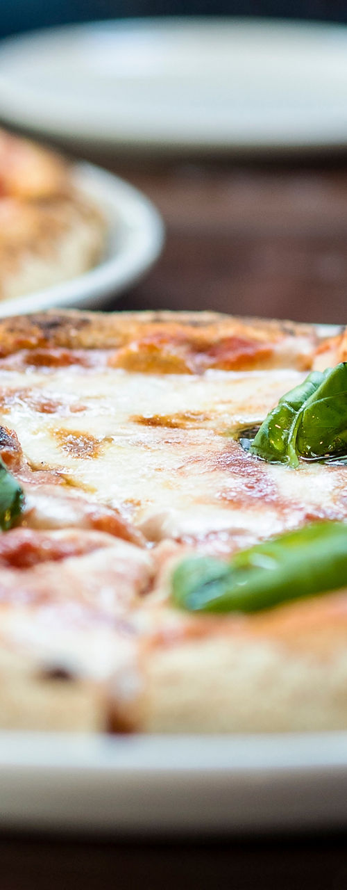 Freshly baked pizzas served with drinks
