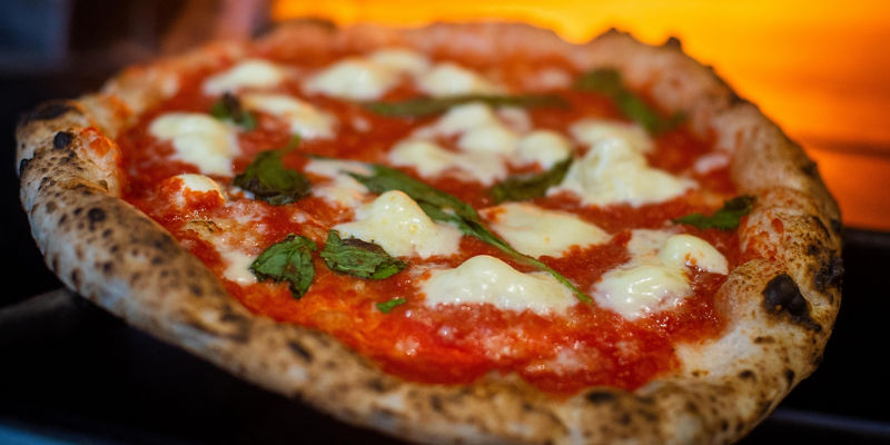 Wood-fired pizza with fresh toppings