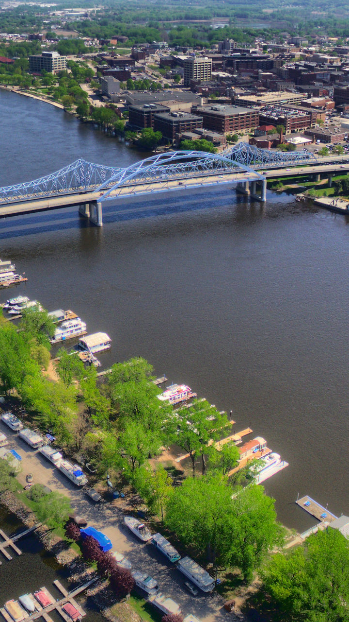 Aerial view of riverfront cityscape and marina