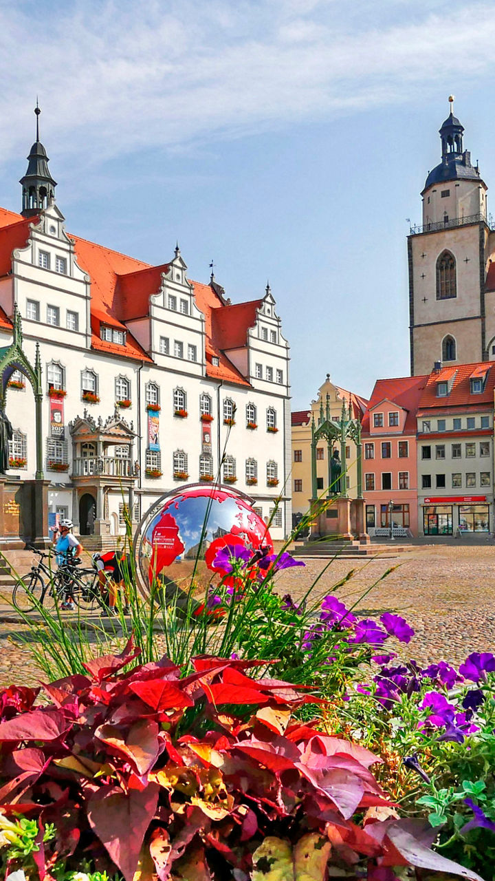 Historic town square with vibrant flowers