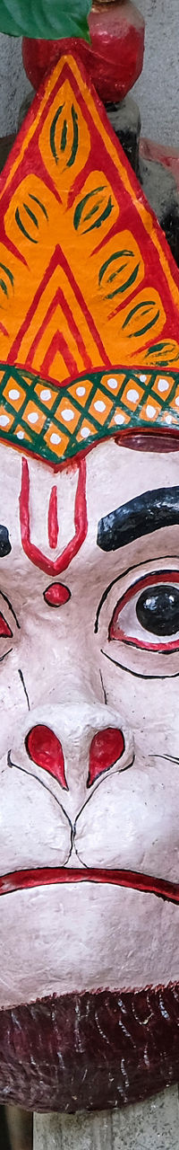 Traditional mask with vibrant colors in outdoor setting