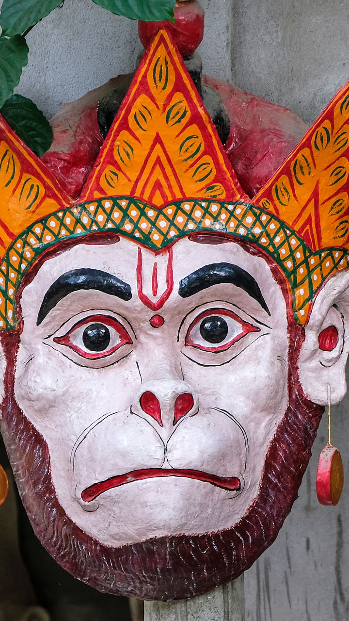 Traditional mask with vibrant colors in outdoor setting