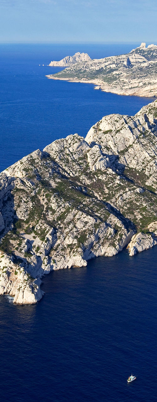 Aerial view of rocky coastline and blue sea