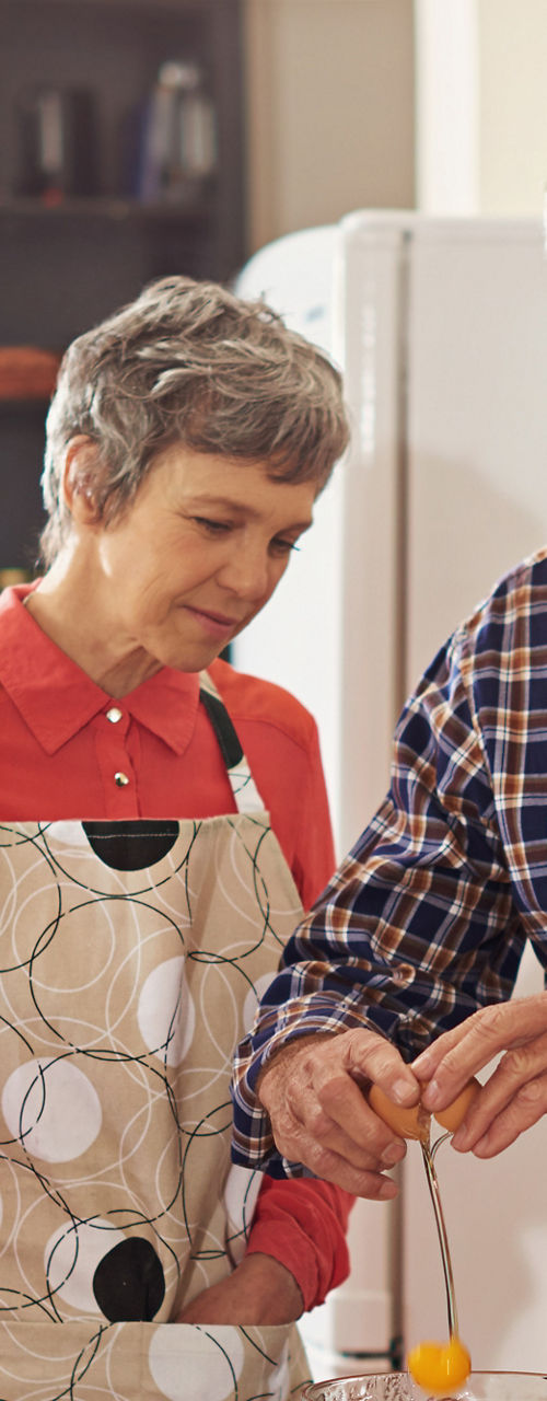 Group cooking together in a kitchen