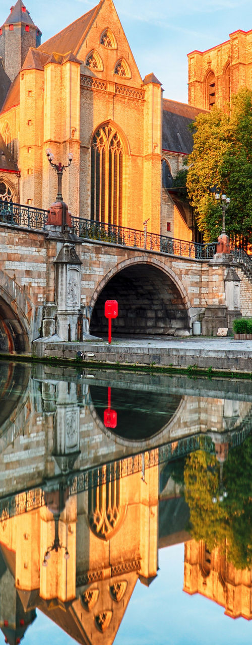 Historic architecture by canal in Ghent