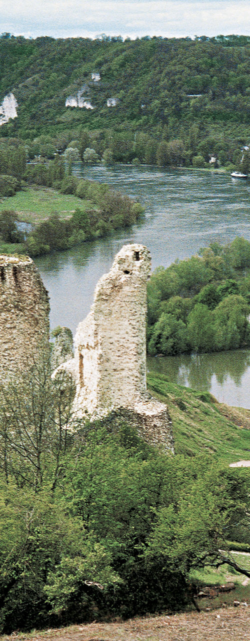 Historic castle ruins overlooking scenic river valley