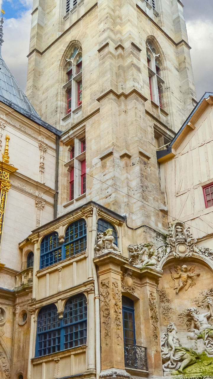 Historic clock in Rouen cityscape