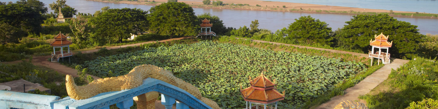 Scenic view of riverside garden with gazebos
