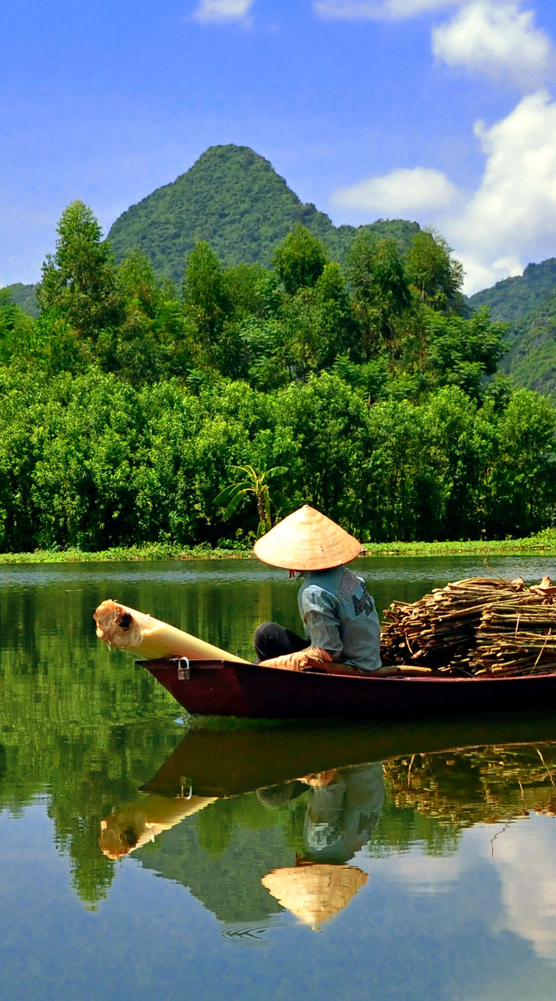 Traditional boat on serene mountain river