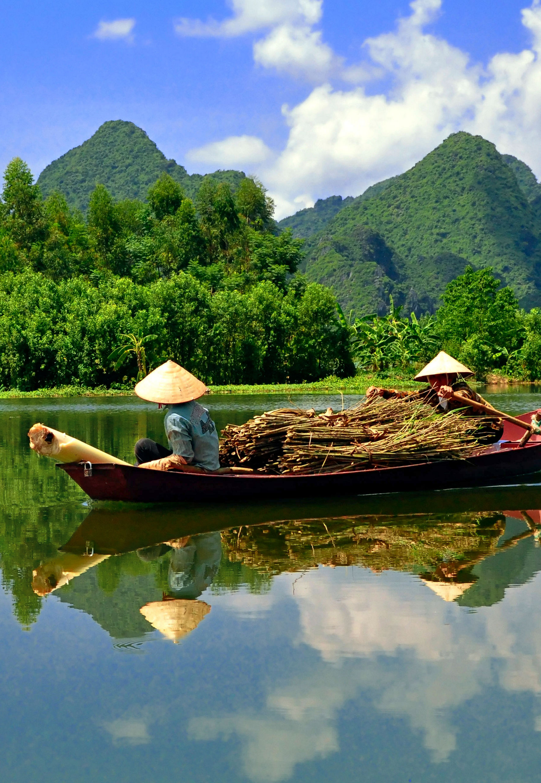 Traditional boat on serene mountain river