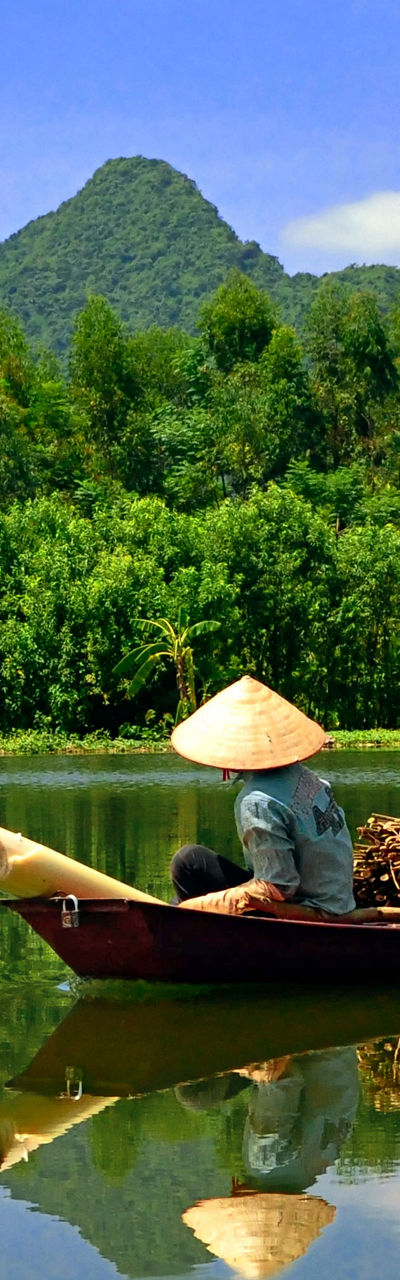 Traditional boat on serene mountain river
