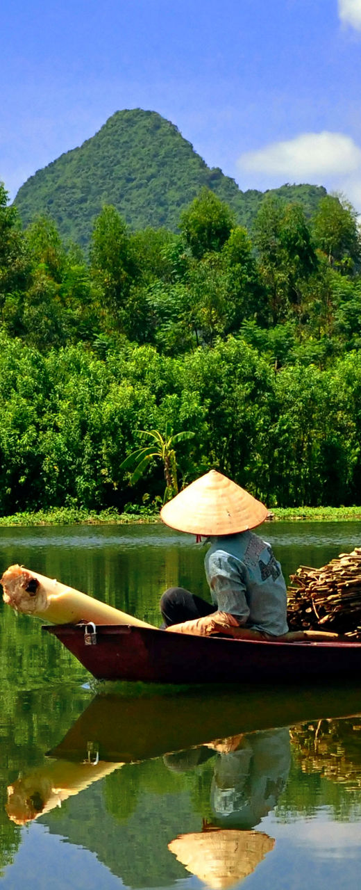 Traditional boat on serene mountain river