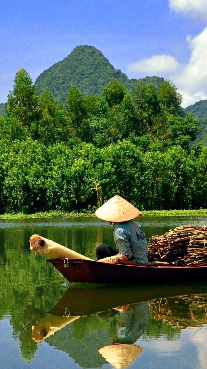 Traditional boat on serene mountain river
