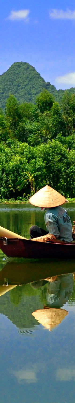 Traditional boat on serene mountain river
