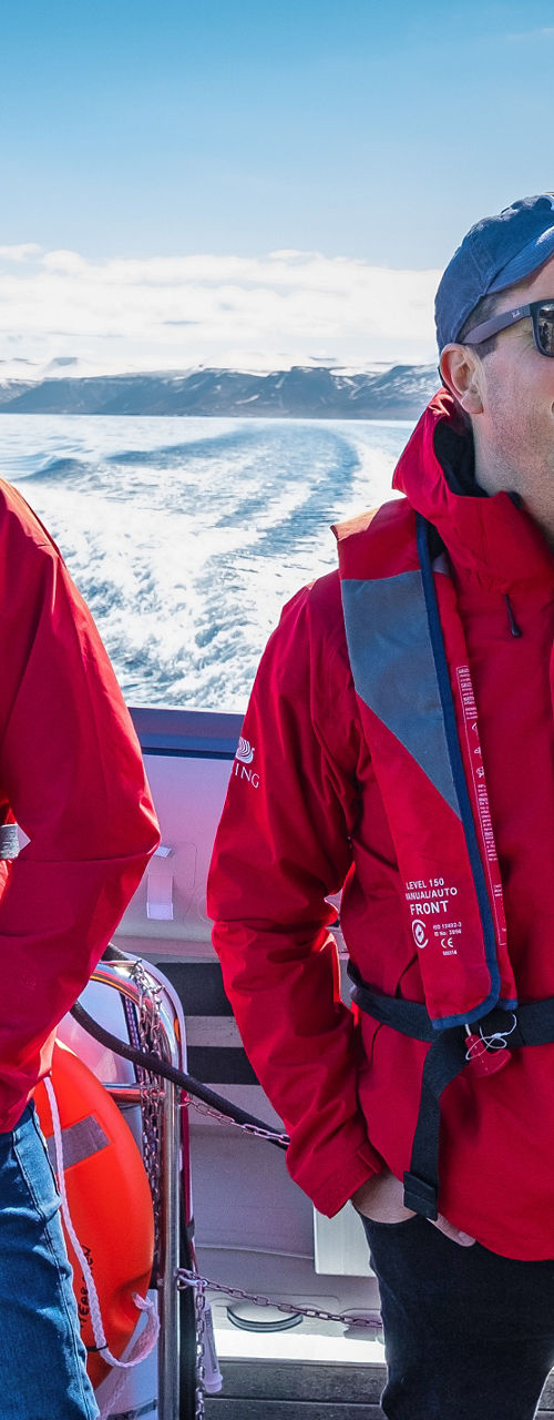 Two people on a boat in icy waters