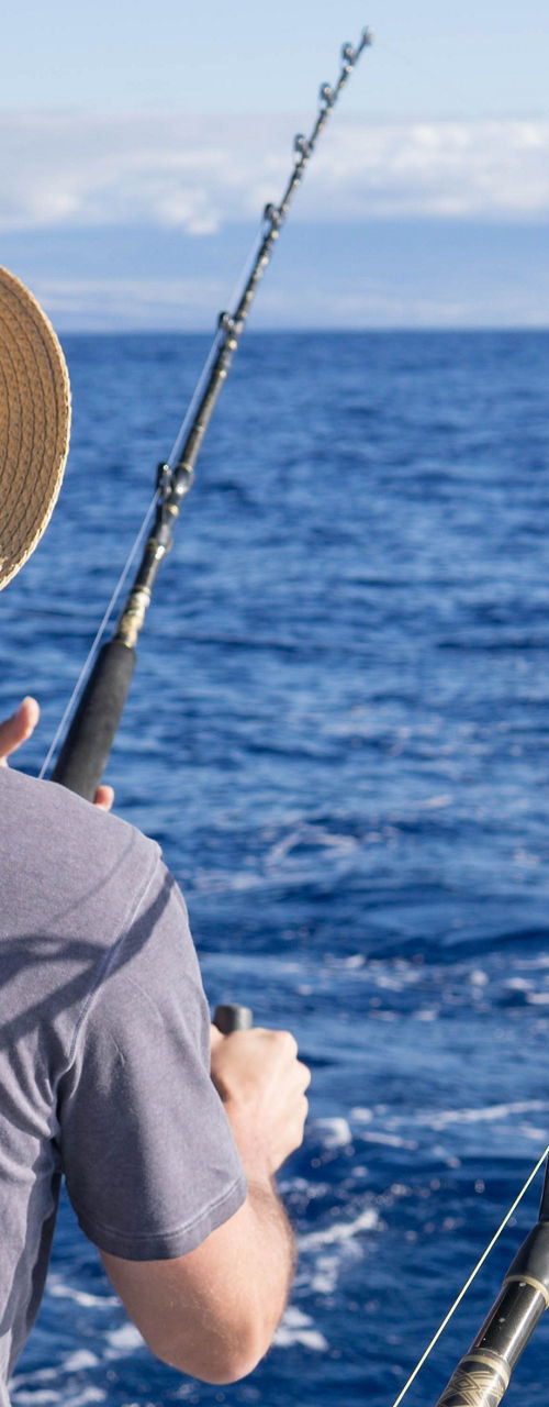 Two men fishing on open ocean
