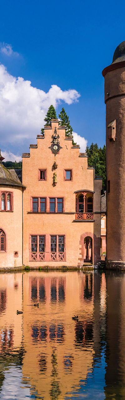 Historic castle by serene lake view