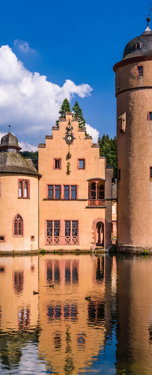 Historic castle by serene lake view