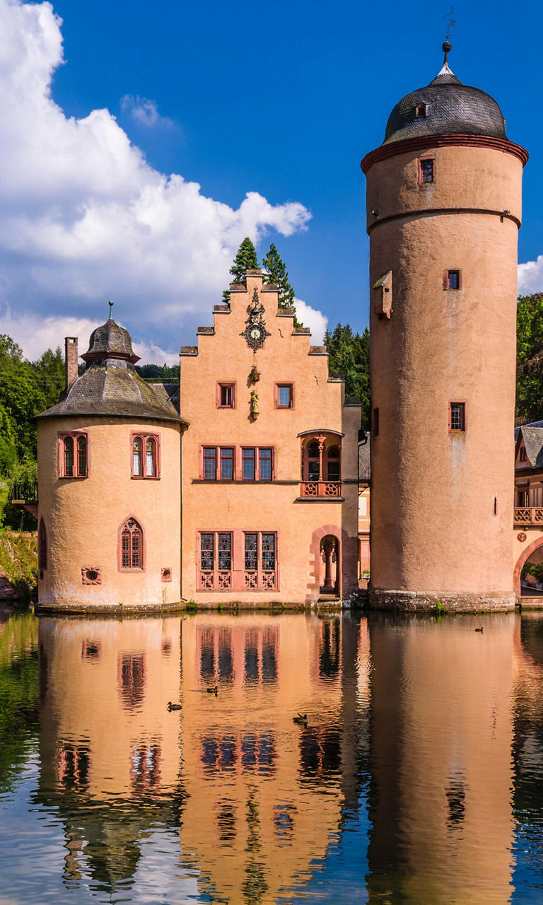 Historic castle by serene lake view