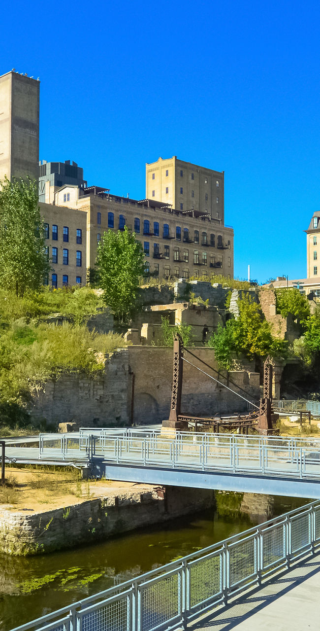 Urban park with historic architecture and bridge