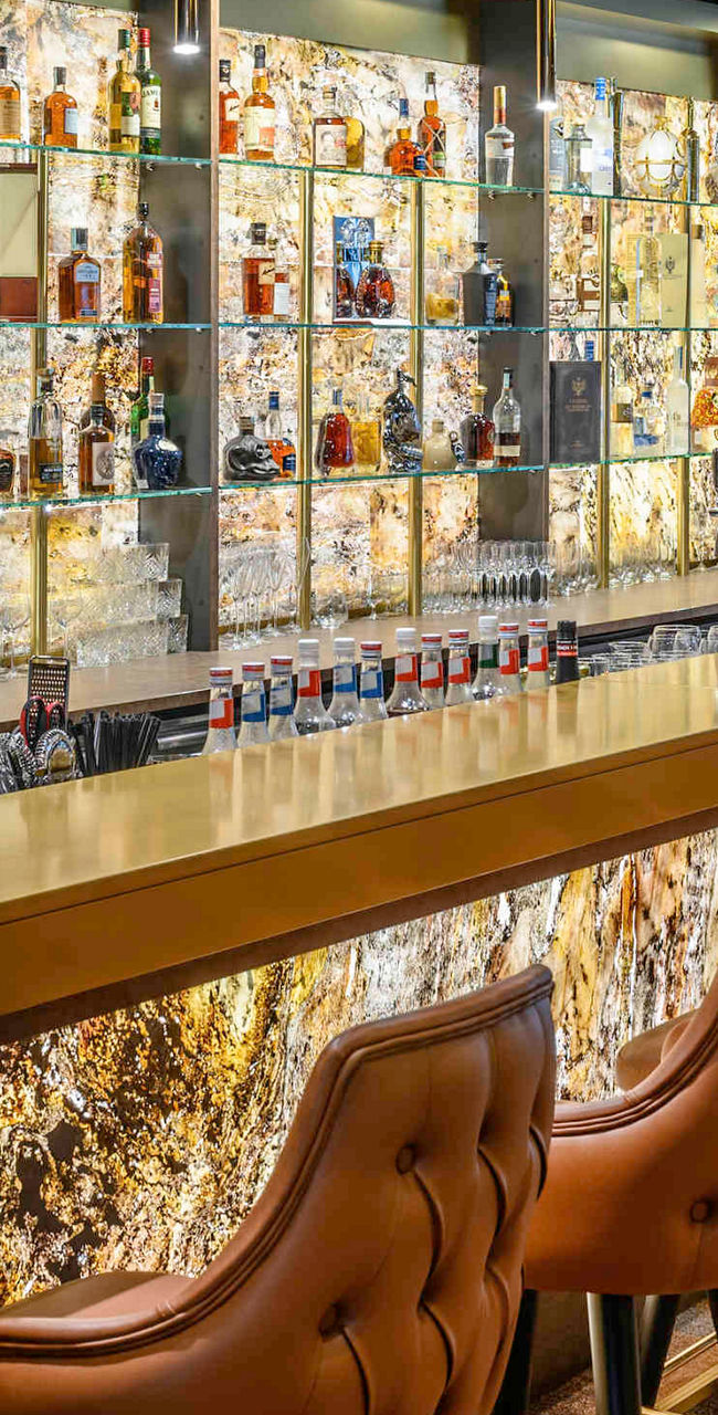 Modern bar with illuminated bottle display