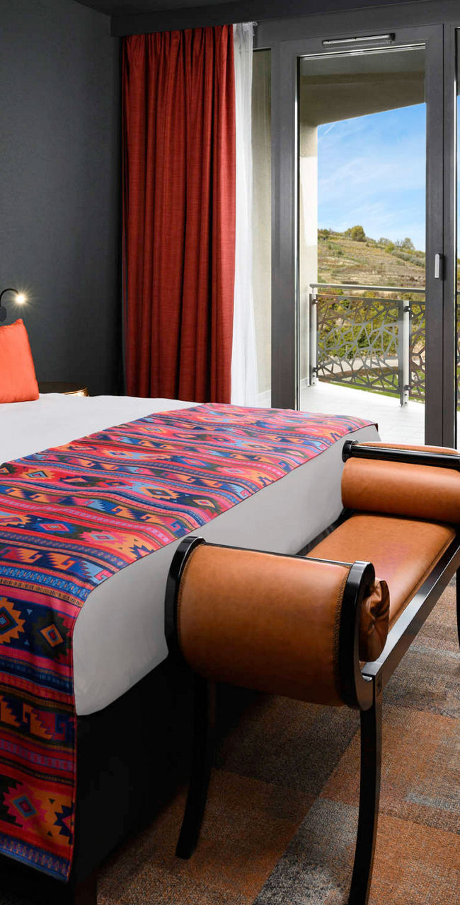 Modern hotel room with vibrant decor