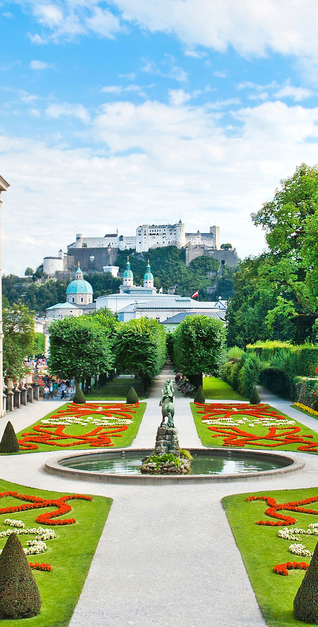 Elegant European Garden with Historic Castle View